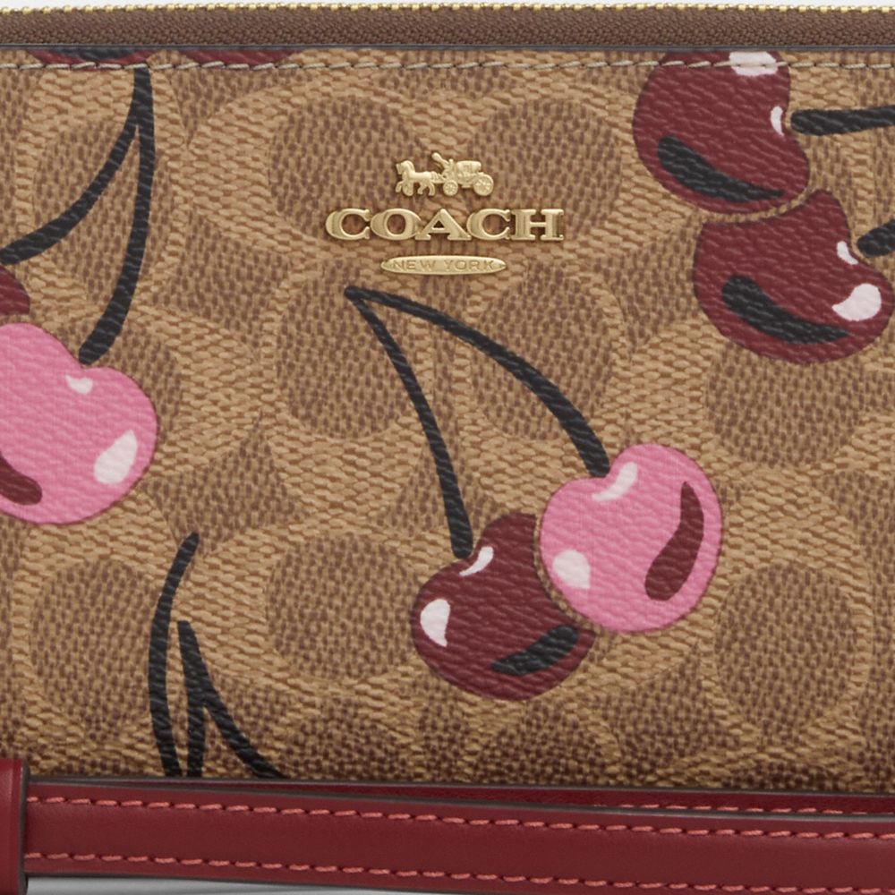 Lange Geldbörse mit Reißverschluss aus charakteristischem Canvas mit Kirschmuster